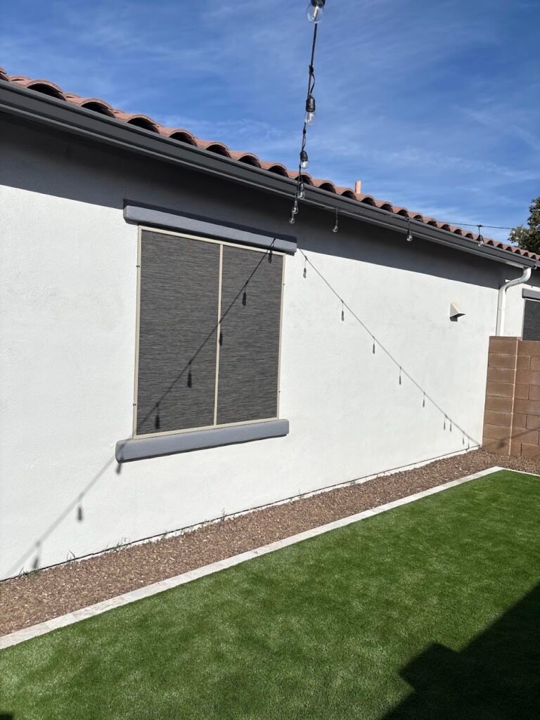 Custom SunTex 90 window sun screens installed beside artificial turf at a Phoenix-area home