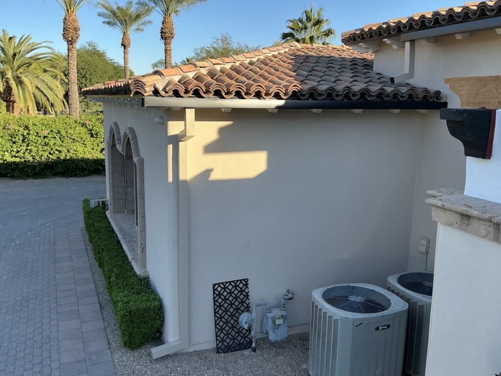 Six-inch aluminum European box gutters with custom square downspouts installed on a Phoenix-area home