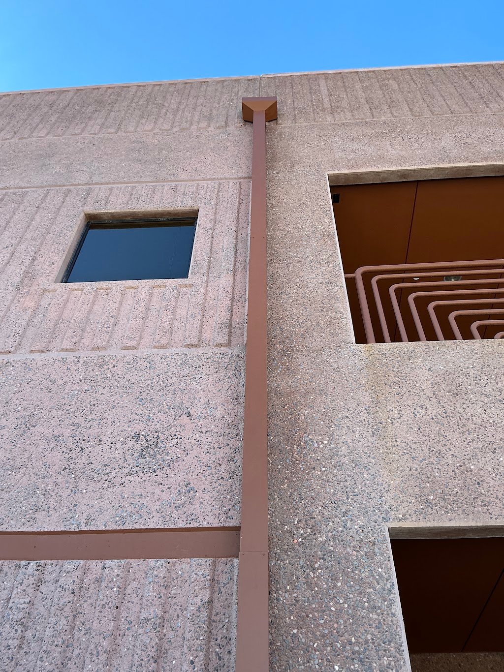 Custom galvanized scupper box and downspout installed on a commercial building in Phoenix, Arizona