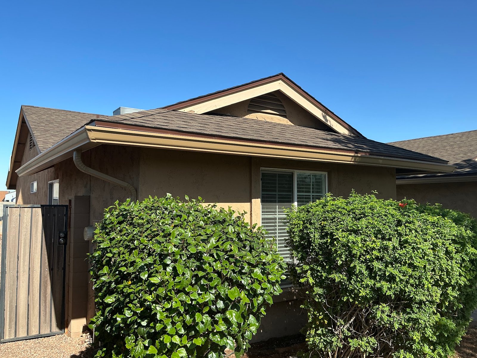 Seamless 6-inch K-style aluminum rain gutters installed on a Phoenix-area home