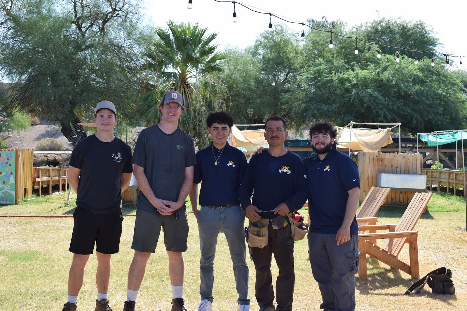 Rain gutter installation supporting a rainwater-harvesting project for Creighton Community Foundation in Phoenix